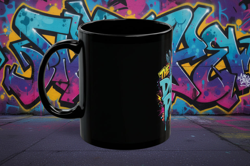 Black mug with colorful graphic design on a white background
