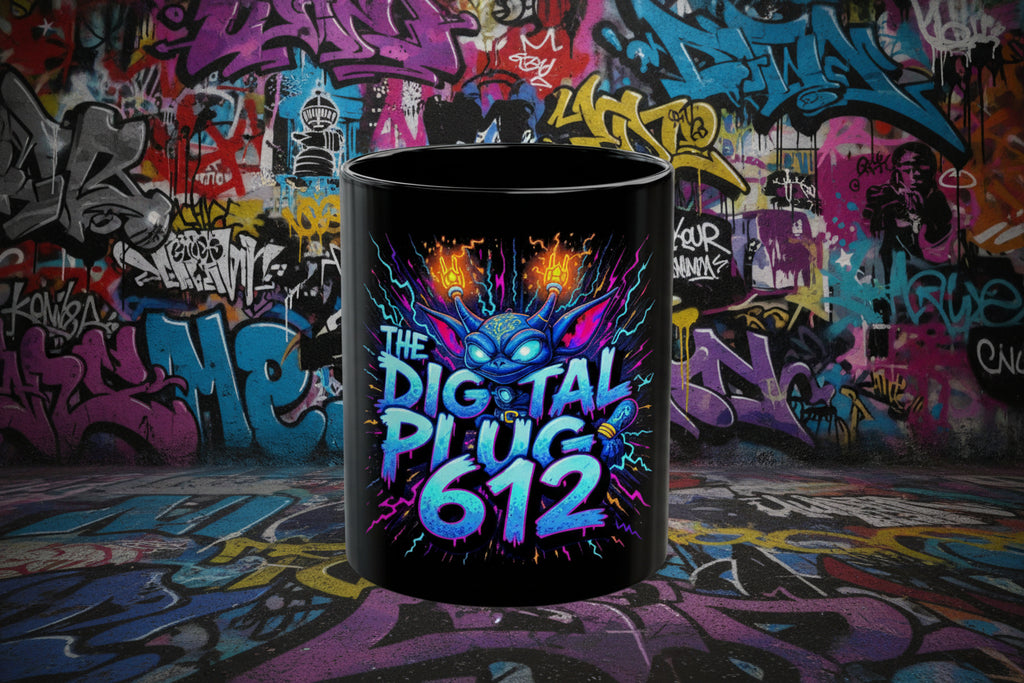 Black mug with colorful graphic and text 'The Digital Plug 612' on a white background