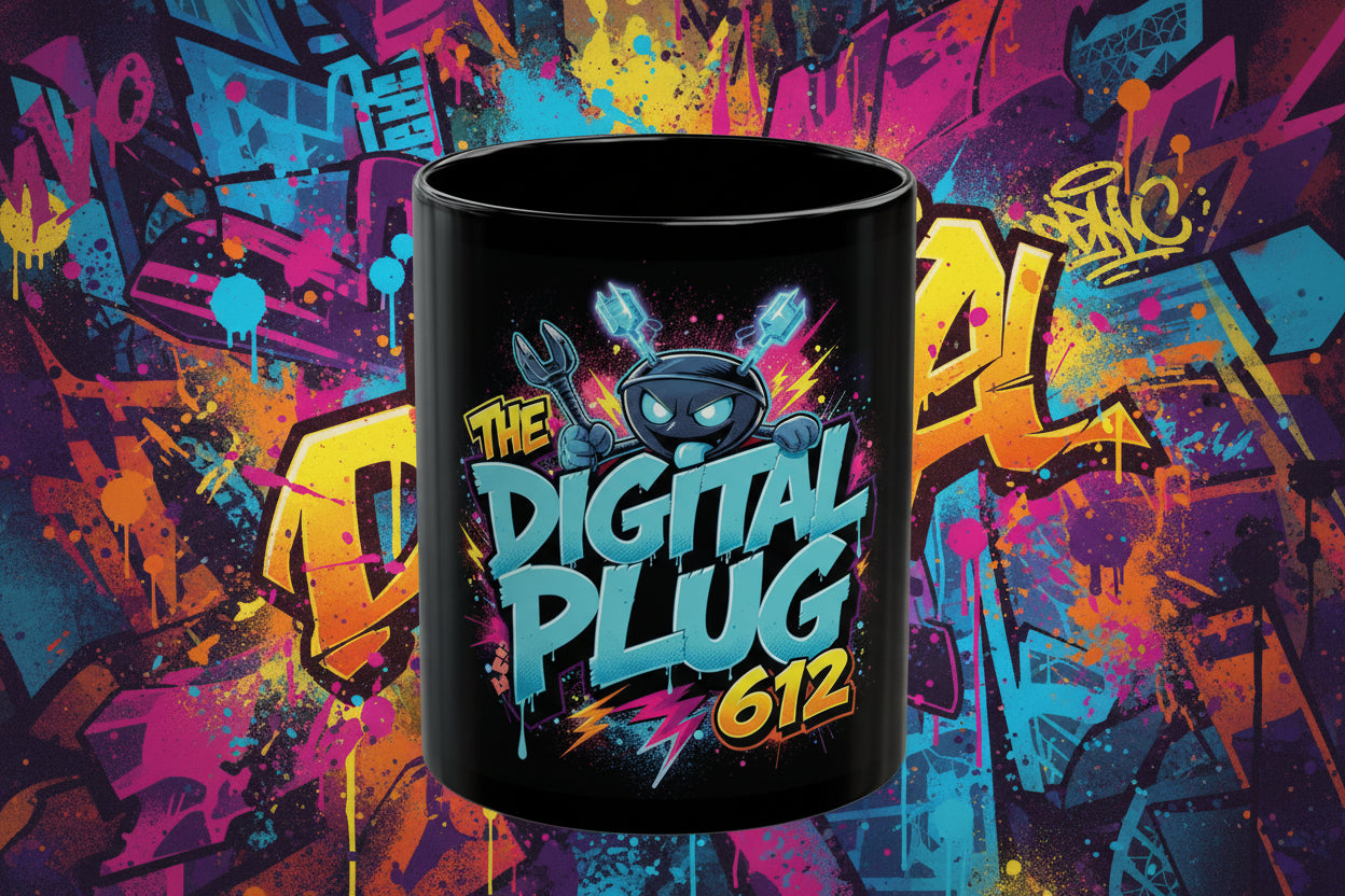 Black mug with colorful 'The Digital Plug 612' design on a white background