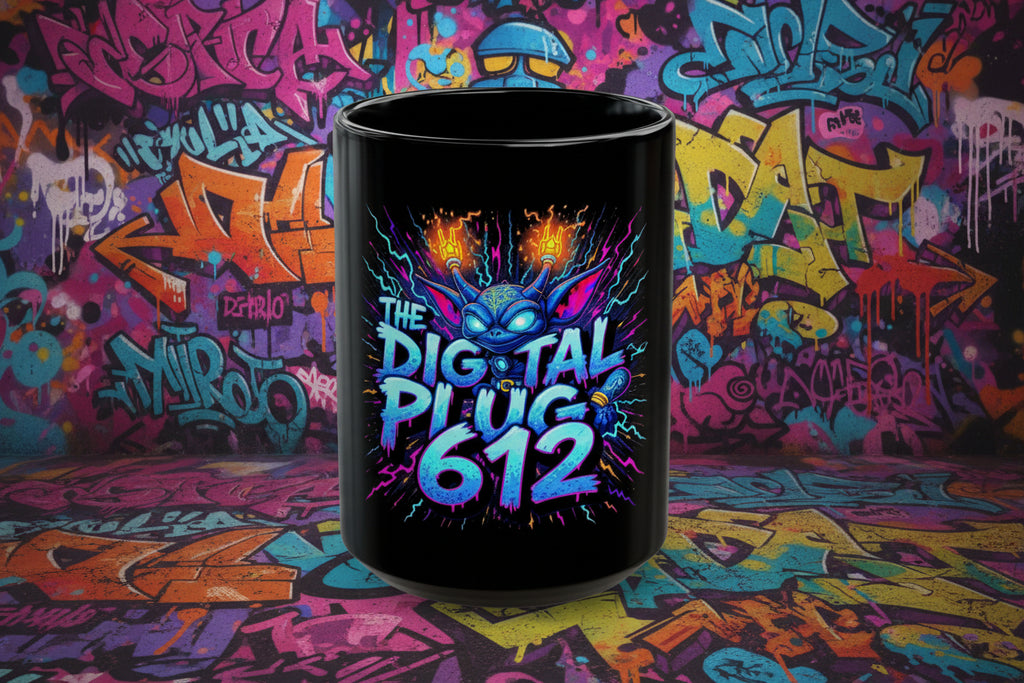 Black mug with colorful graphic and text 'The Digital Plug 612' on a white background
