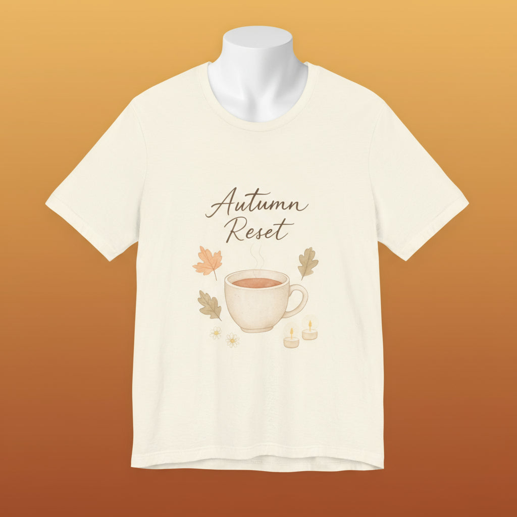Beige t-shirt with 'Autumn Reset' design featuring a cup and leaves on a white background