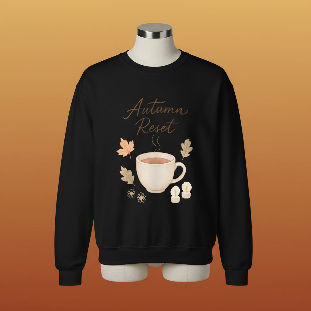 Black sweatshirt with 'Autumn Reset' design featuring a cup and leaves on a white background