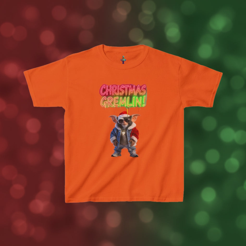 Orange t-shirt with a Christmas Gremlin graphic on a white background