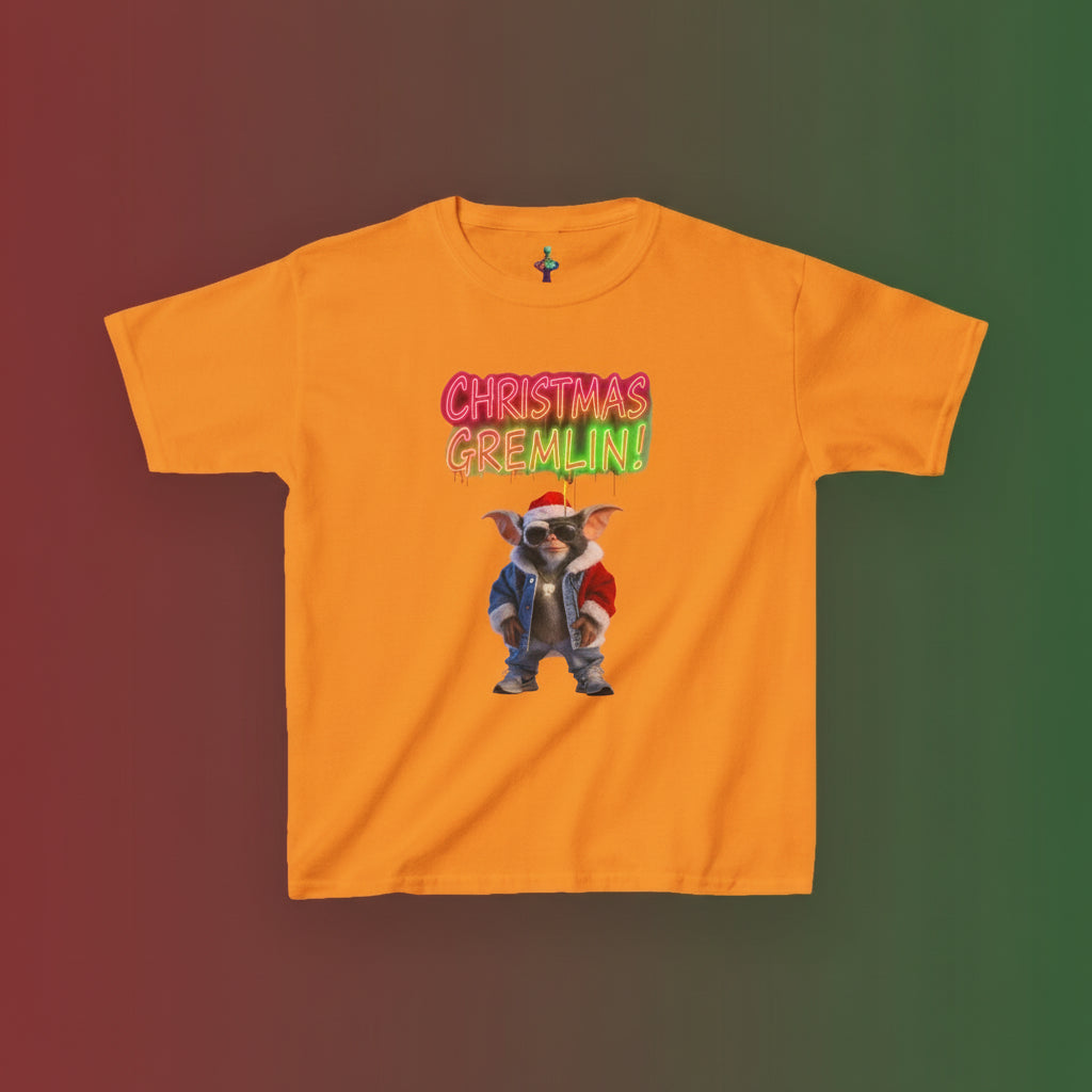 Orange t-shirt with a graphic of a dog in a Santa hat and text 'Christmas Gremlin' on a white background